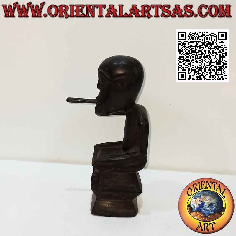 Sculpture of a seated indigenous smoker in ebony wood
