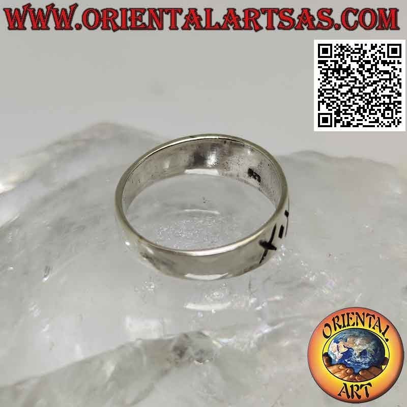 Silver ring with crescent band with alternating engraved X and dot