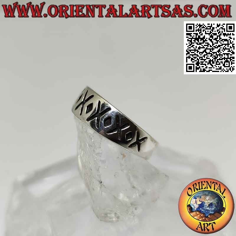 Silver ring with crescent band with alternating engraved X and dot