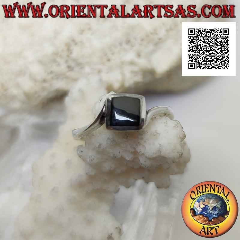 Silver ring with asymmetrical setting with rhomboidal square onyx flush with the central edge