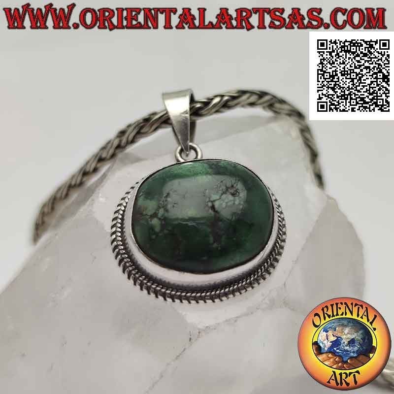 Colgante de plata con turquesa antigua tibetana irregular ovalada natural rodeada por un tejido doble