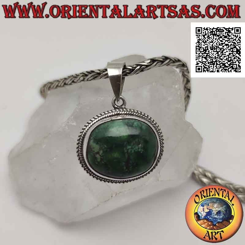 Ciondolo in argento con turchese antico tibetano naturale ovale irregolare contornato da doppio intreccio