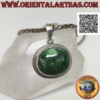 Silver pendant with natural oval irregular Tibetan antique turquoise surrounded by a double weave