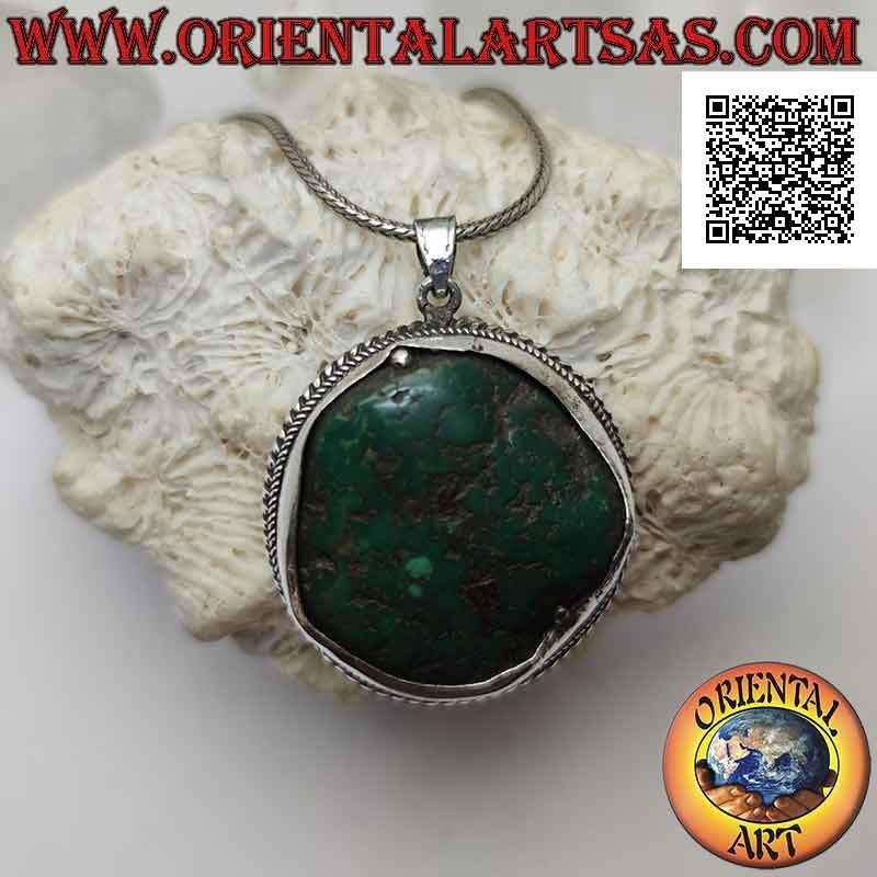 Ciondolo in argento antico con turchese tibetano naturale irregolare contornato da intreccio