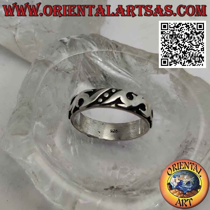 Silver ring with worked band with Maori decoration in high relief