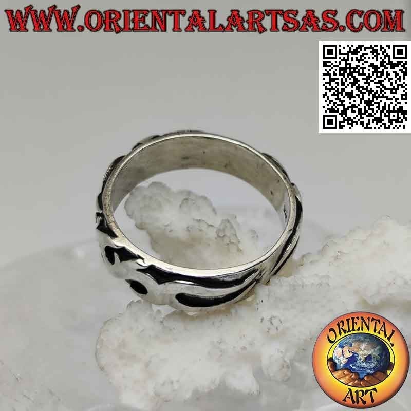 Silver ring with worked band with Maori decoration in high relief