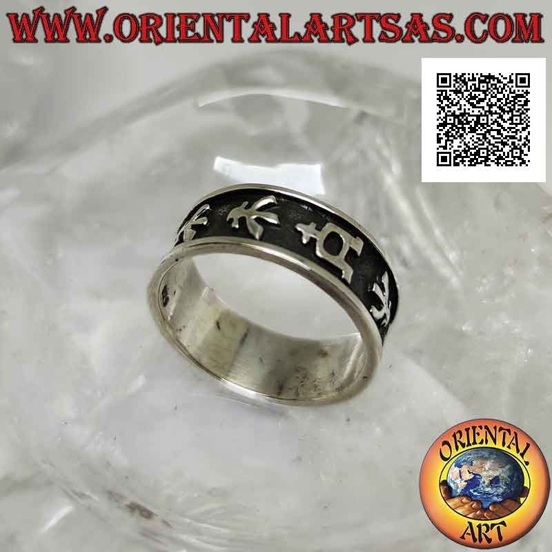 Silver band ring worked with a series of ideograms in bas-relief