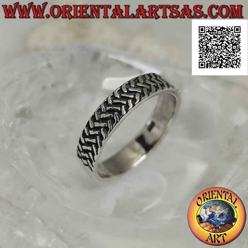 Silver ring with worked band with three rows of intertwined oblique segments