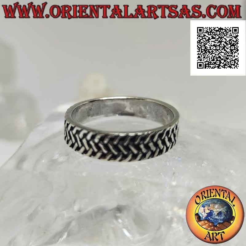Silver ring with worked band with three rows of intertwined oblique segments