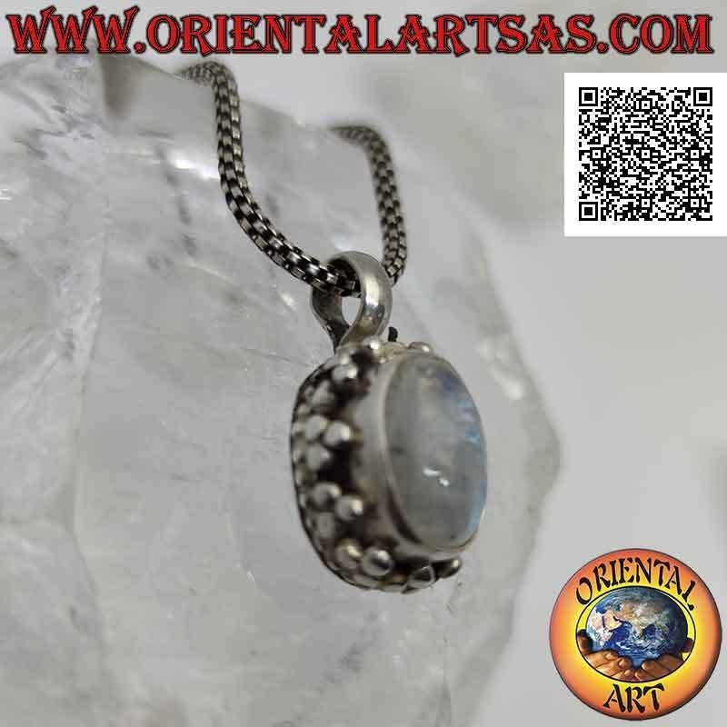 Silver pendant with cabochon oval moonstone surrounded by a double row of balls and tris