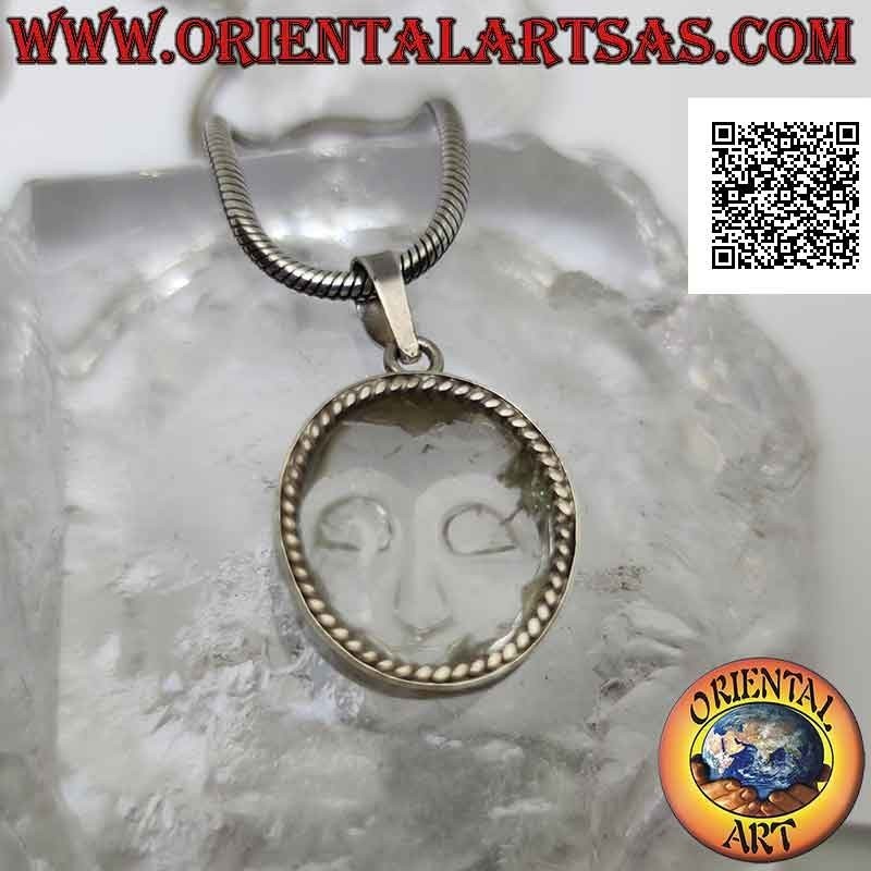 Silver pendant with the face of serenity engraved on rock crystal