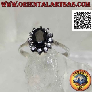Silver flower ring with natural oval sapphire set with white zircon petals set