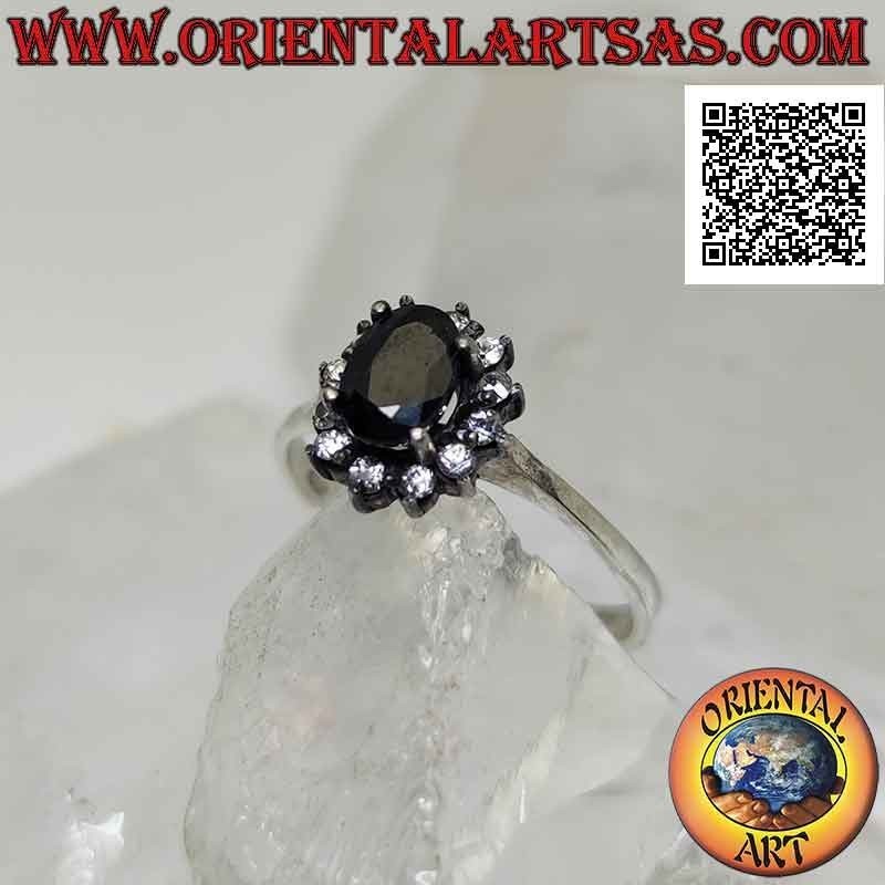 Anillo flor de plata con zafiro ovalado natural engastado con pétalos de circonitas blancas engastadas