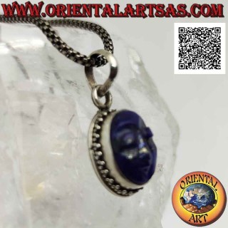 Silver pendant with the face of serenity engraved on lapis lazuli surrounded by trio of balls
