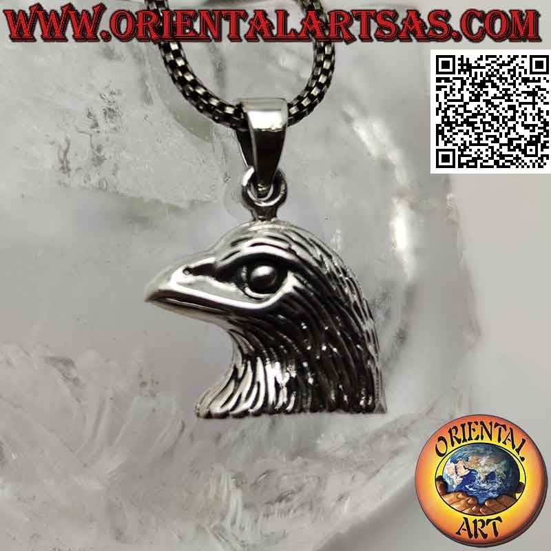 Colgante de plata, cabeza de águila dorada de perfil.