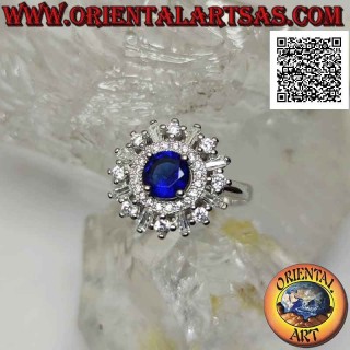Anillo de plata con zafiro sintético redondo engastado rodeado de una banda y circonitas redondas y baguette