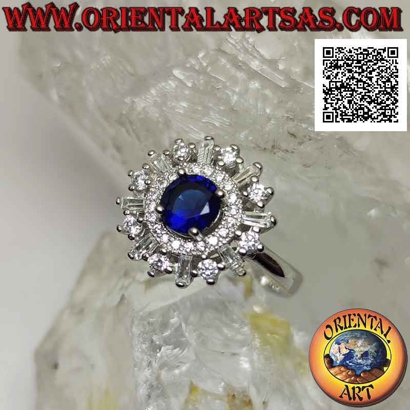 Silver ring with round synthetic sapphire set surrounded by a band and round and baguette zircons