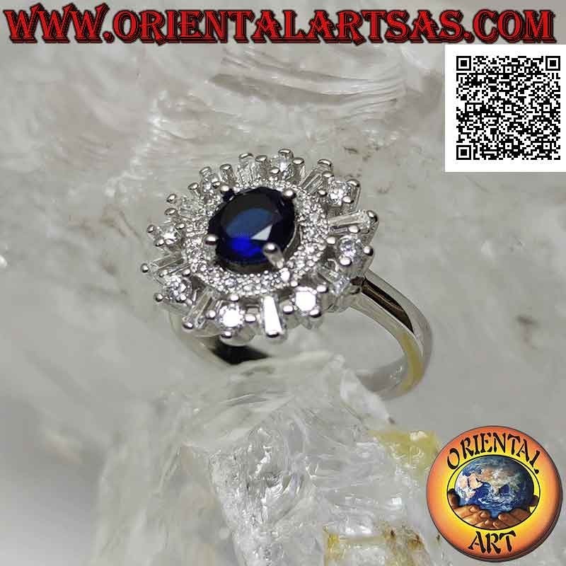 Anillo de plata con zafiro sintético redondo engastado rodeado de una banda y circonitas redondas y baguette