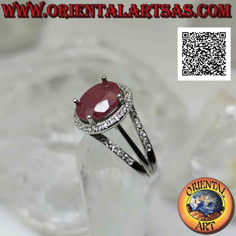 Silver ring with large oval natural ruby set surrounded by white zircons and three lines