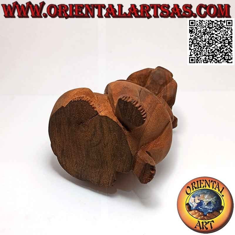 Sculpture of a seated English bulldog hand carved from a single 16 cm block of suar