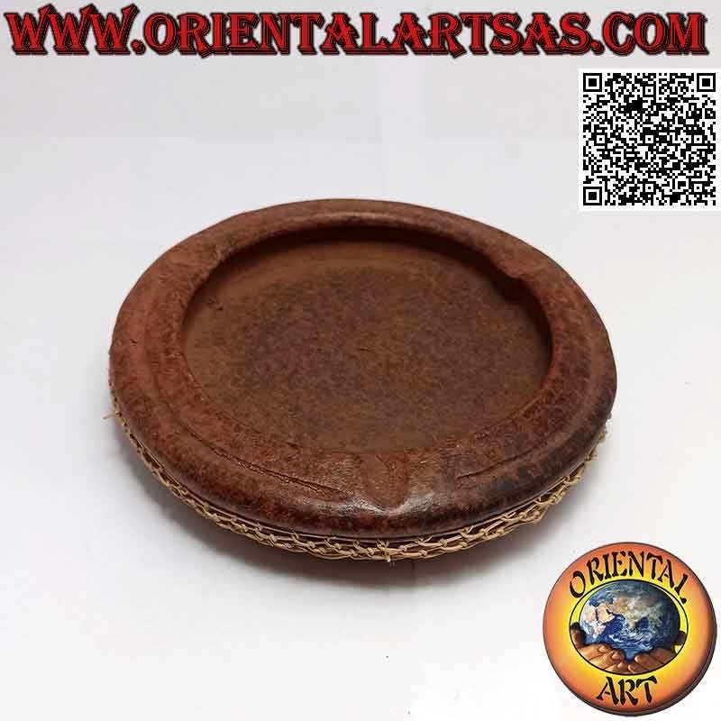 Round ashtray with woven wicker decoration, traditional of Lombok in terracotta