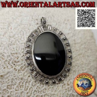 Silver pendant with large oval onyx surrounded by silver bands with central marcasite