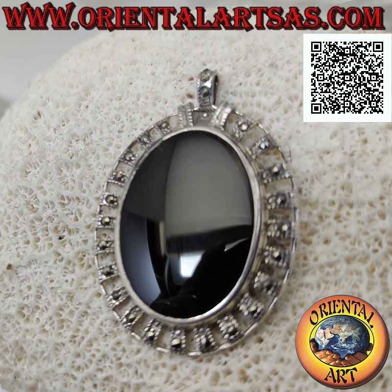 Silver pendant with large oval onyx surrounded by silver bands with central marcasite
