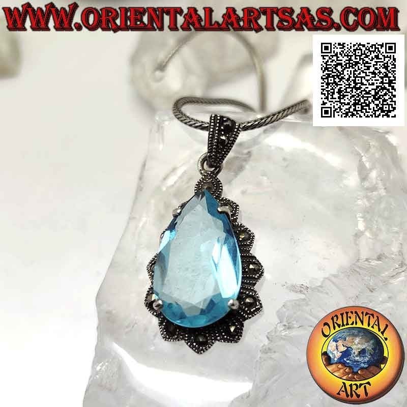 Silver pendant with large teardrop blue topaz set in an imperial setting studded with marcasite