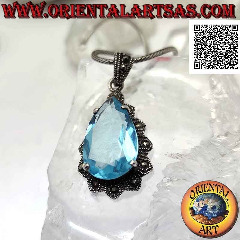 Silver pendant with large teardrop blue topaz set in an imperial setting studded with marcasite