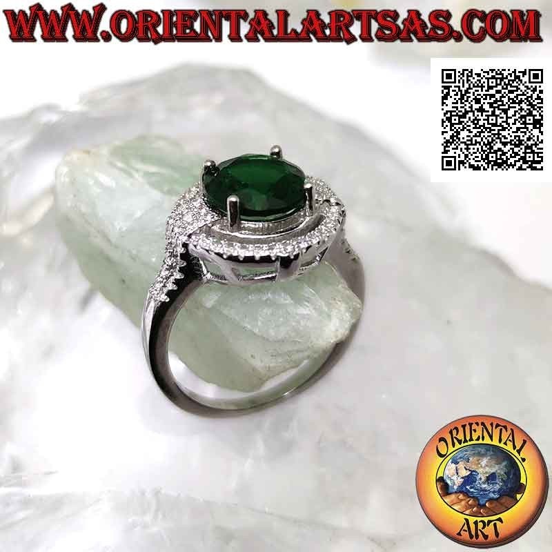 Silver ring with round synthetic emerald set surrounded by zircons with relief on the cardinal points