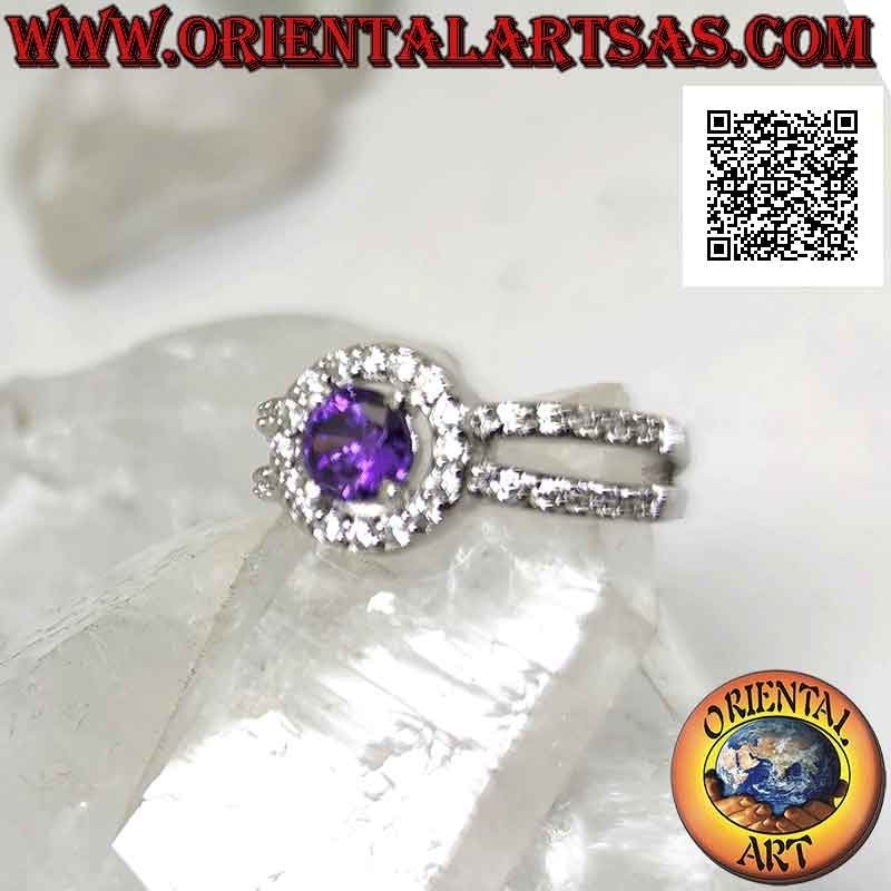 Silver ring with natural round amethyst set surrounded by xircons and hooked to two