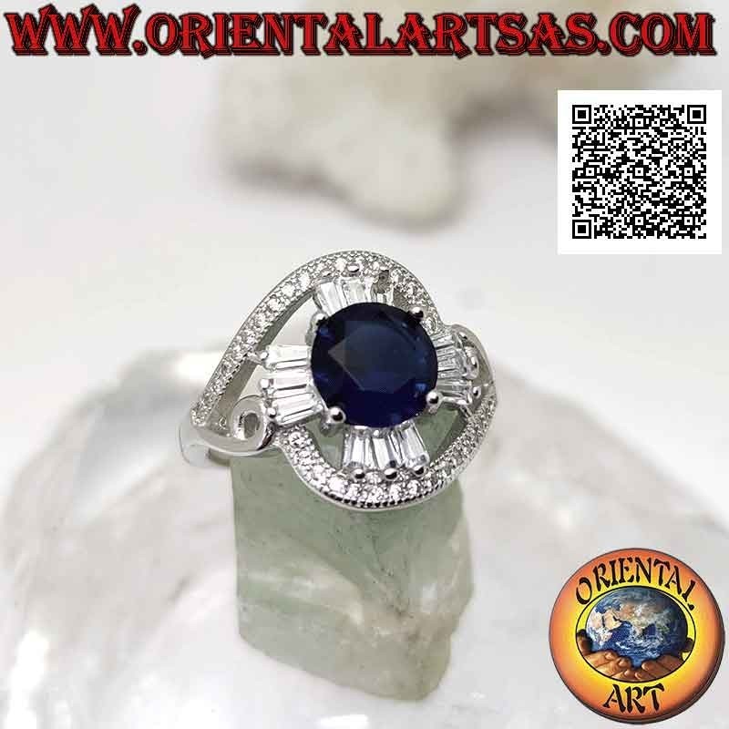 Silver ring with round synthetic sapphire set on a cross of baguette-cut white zircons