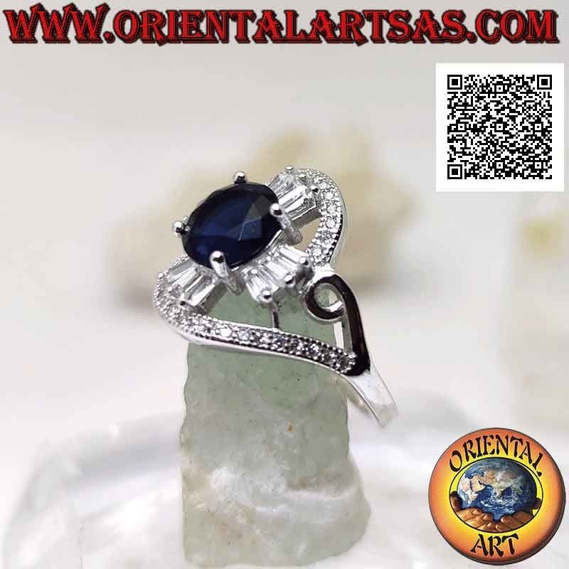 Bague en argent avec saphir synthétique rond serti sur une croix de zircons blancs taille baguette