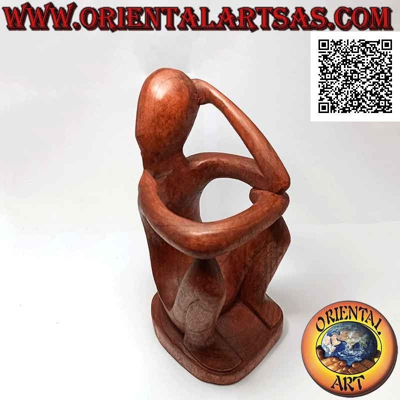 Portabotellas escultura de un pensador sentado en reflejo en madera de Suar