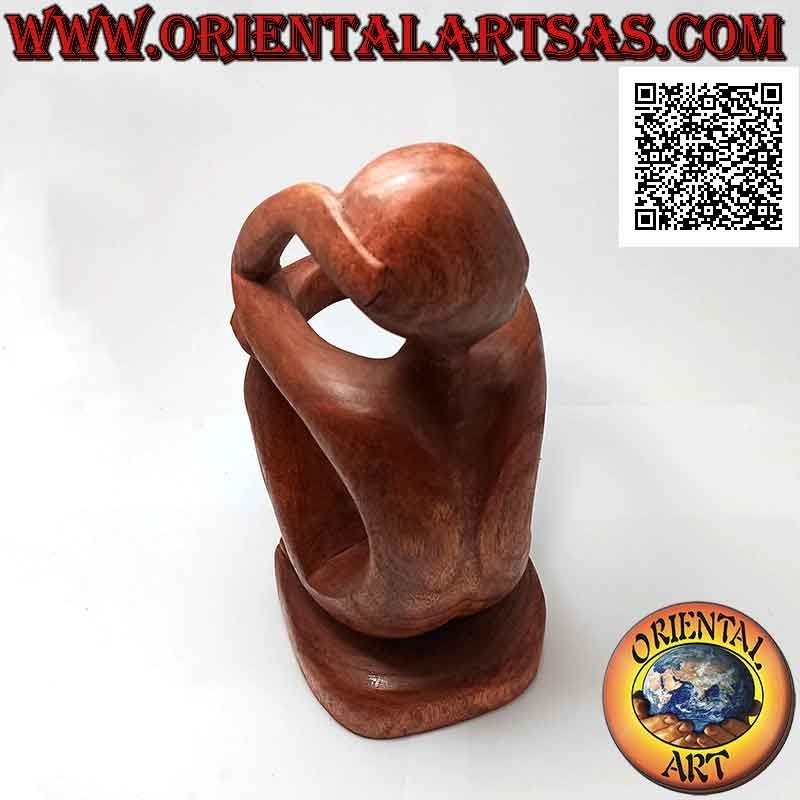 Portabottiglie scultura di un pensatore seduto in riflessione in legno di Suar