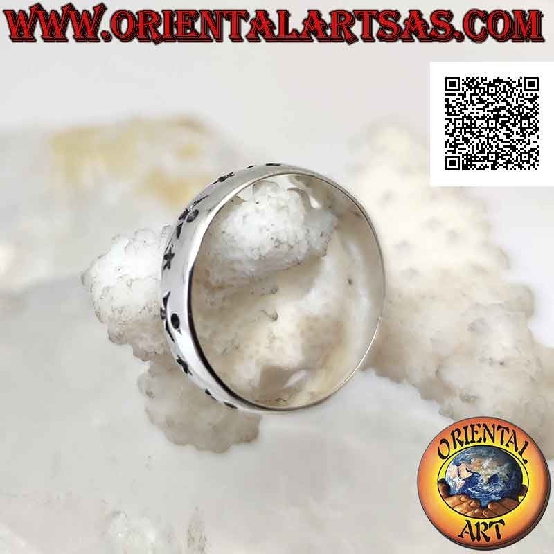 Silver band ring worked with stars and alternating astral decoration