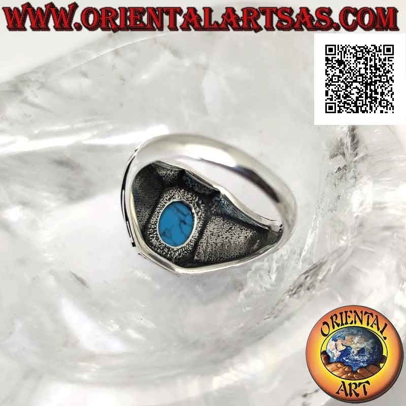 Bague en argent avec cabochon ovale turquoise et vagues en bas-relief sur les côtés