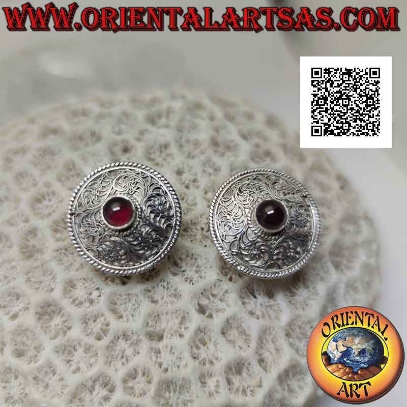 Silver earrings from rounded shield lobe decorated in filigree with natural round garnet in the center