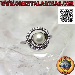 Silver ring with freshwater pearl in the center of a zircon spiral