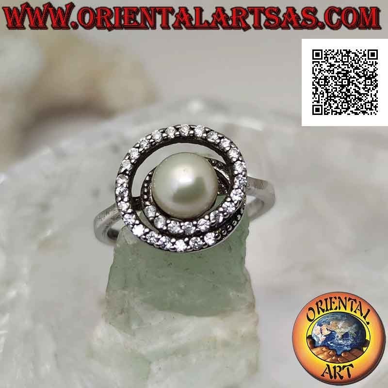 Bague en argent avec perle d'eau douce au centre d'une spirale de zircon