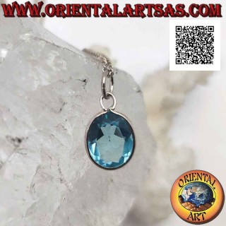 Silver pendant with oval natural blue topaz on a simple setting with a smooth edge