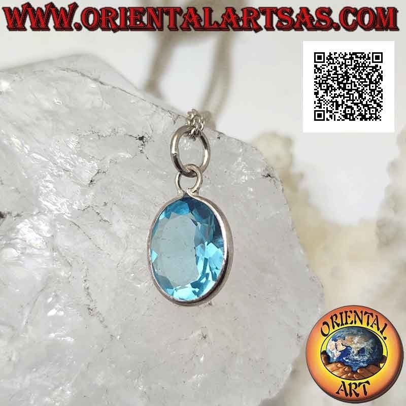 Silver pendant with oval natural blue topaz on a simple setting with a smooth edge