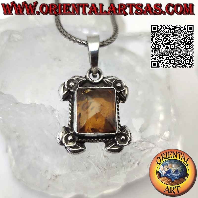 Silver pendant with rectangular Baltic amber surrounded by intertwining and roses on the four corners