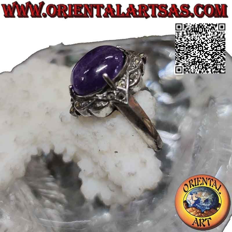 Silver ring with cabochon oval amethyst set in a marcasite-studded setting