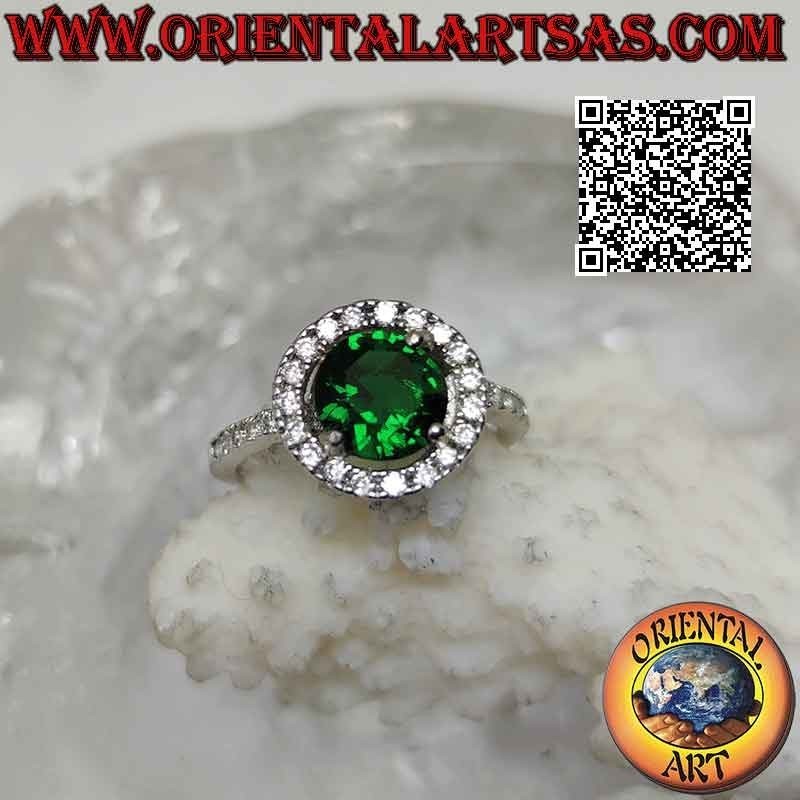 Silver ring with round synthetic emerald set surrounded by zircons and extension on the sides