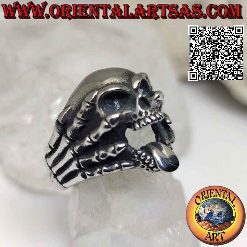 Surgical steel ring (316L), skull with tongue gripped by skeleton hands