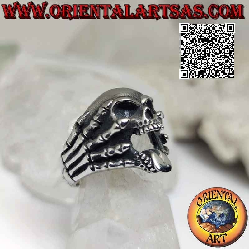 Surgical steel ring (316L), skull with tongue gripped by skeleton hands