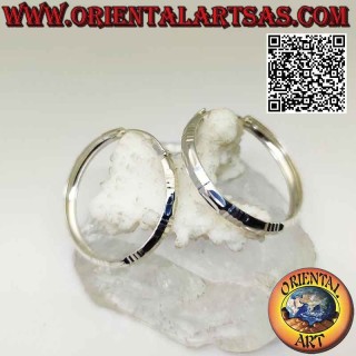 Silver baguette and horizontal 40 mm wide diamond circle earrings.