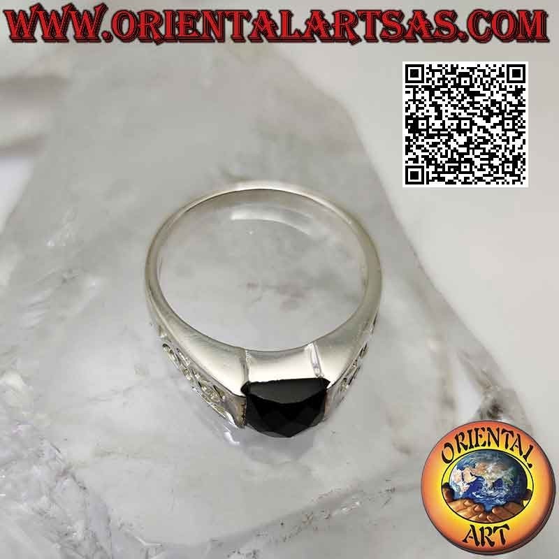 Silver ring with square faceted spinel and openwork floral decoration on the sides