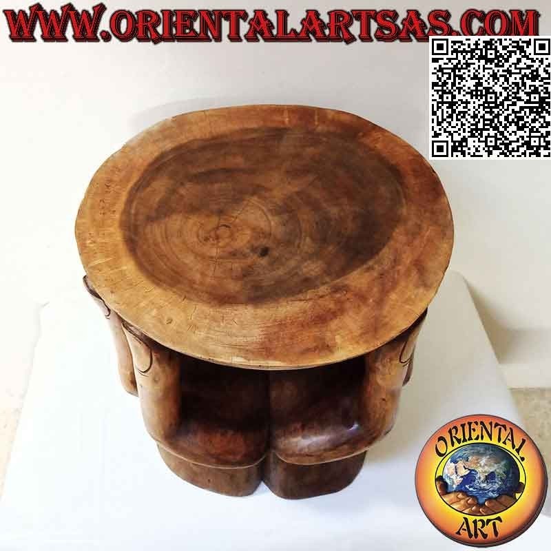 Round living room table with sculpture of two hands supporting the suar wood top (48x 46x 42)